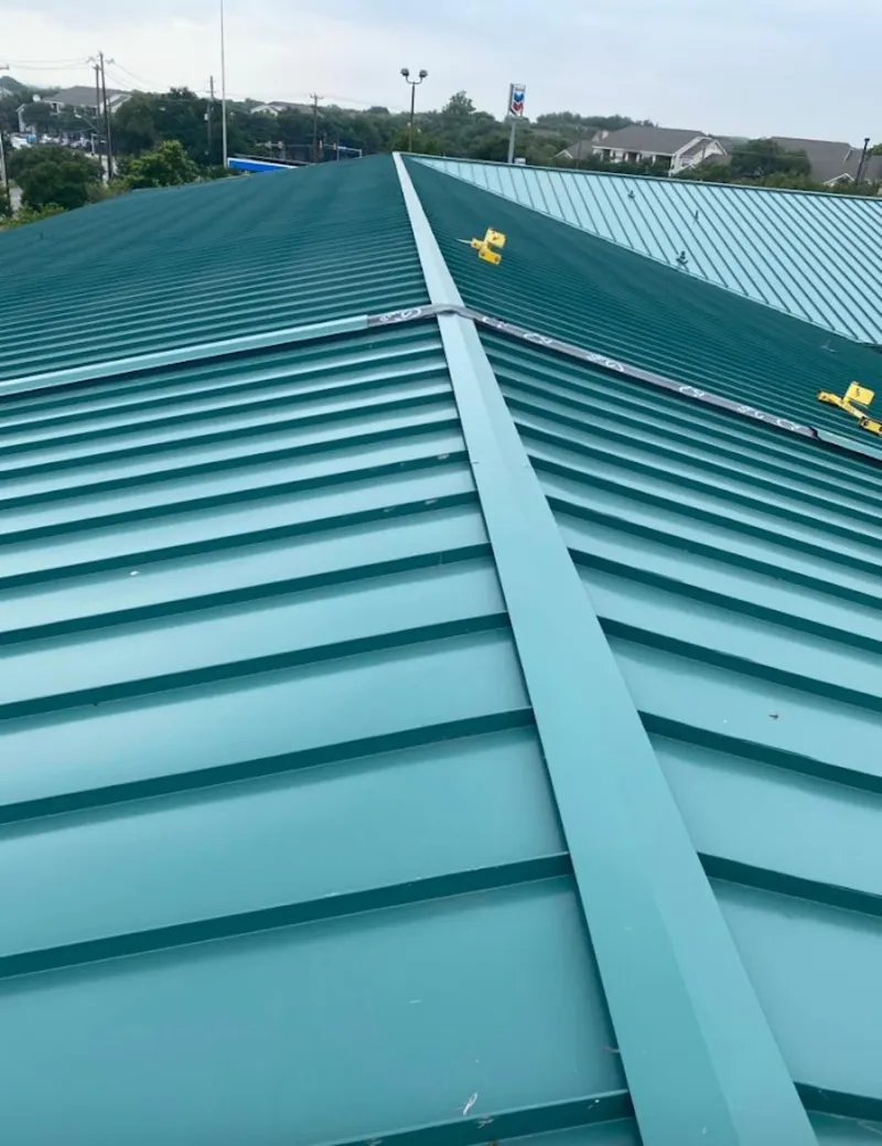Green commercial metal roof ridge and valley for Metal Roof Repair in Mahtomedi
