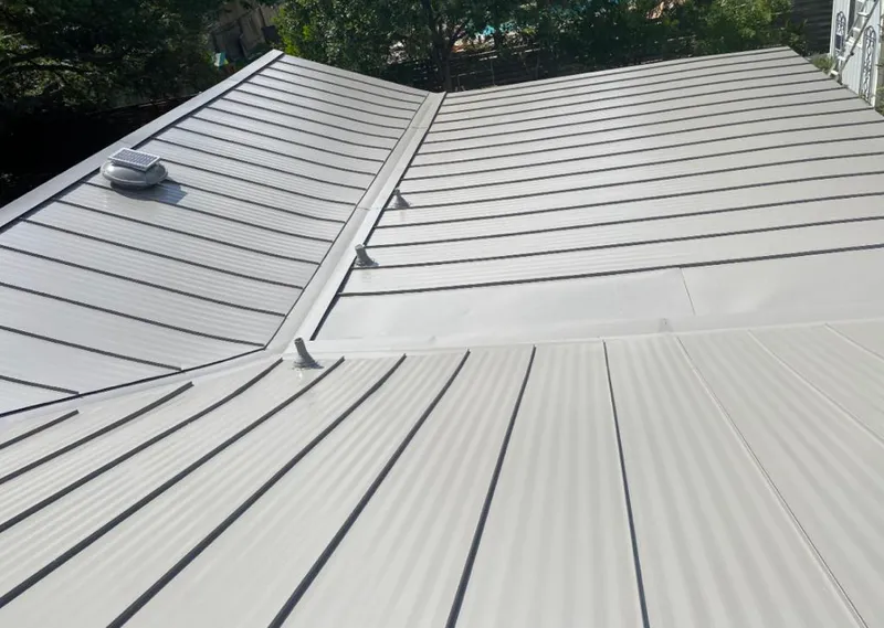 Solar attic fan installed on a metal roof for Roof Ventilation in Mahtomedi